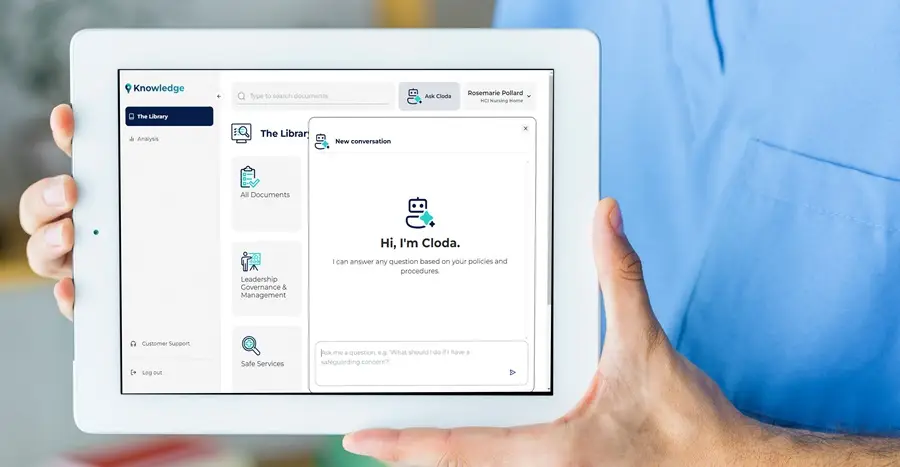 nurse holding tablet with cloda interface